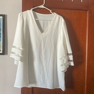 White blouse with bowed out sleeves